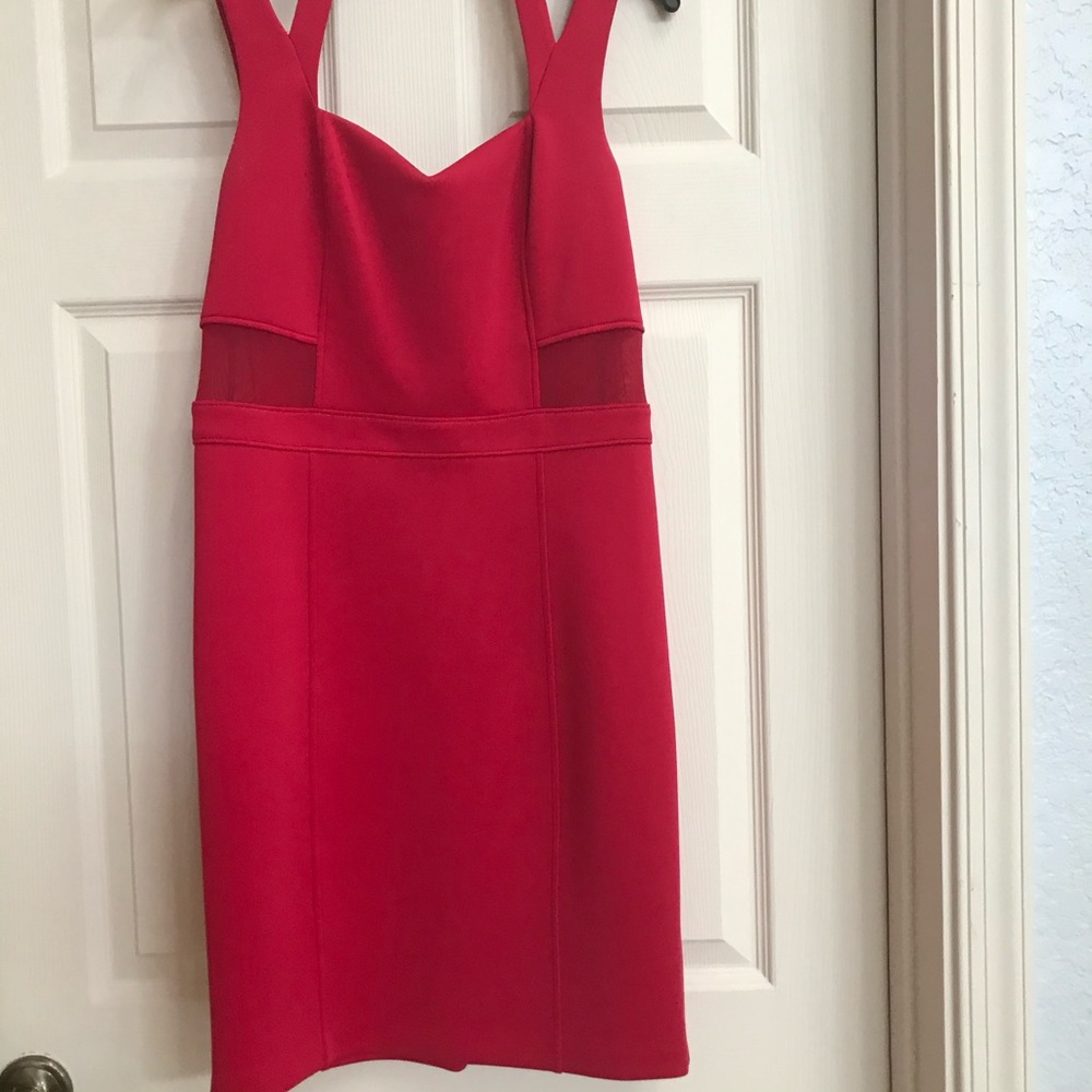 Red cocktail dress by Guess.